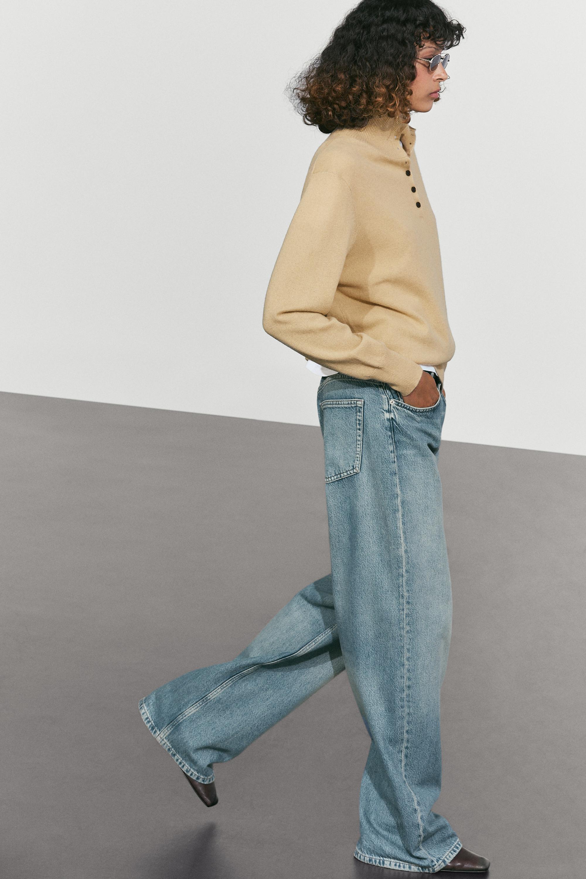 High neck knit sweater with button detail